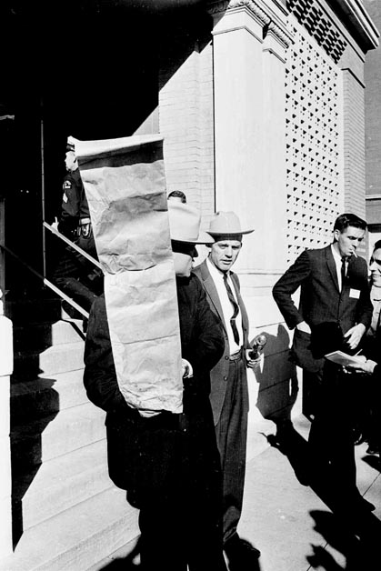 Officer Leaves School Book Depository with Paper Bag that Held Oswald's ...