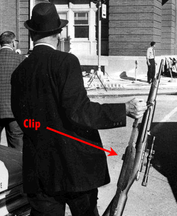 Dallas Police Lt. J.C. Day with Oswald's Mannlicher-Carcano rifle