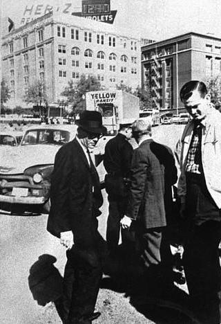 Agent supposedly holds bullet in his hand