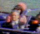 Connally's lapel flaps, perhaps in reaction to a shot at Zapruder frame 223